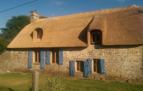 RJ Matravers Thatched house with wooden shutters